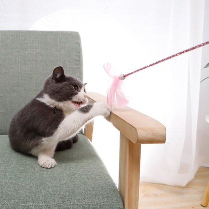 Cat Wand Toy Set Feather Bell in pink three-piece set on a light background.