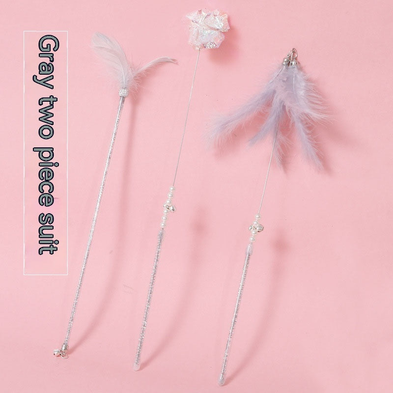 Cat Wand Toy Set Feather Bell in pink three-piece set on a light background.